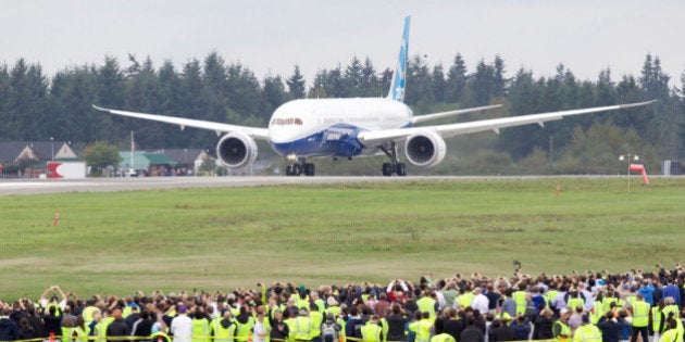 EVERETT, WA - SEPTEMBER 17: A Boeing 787-9 Dreamliner taxis on the runway in front of a crowd of employees before its first flight September 17, 2013 at Paine Field in Everett, Washington. The 787-9 is twenty feet longer than the original 787-8 and can carry more passengers and more fuel. (Stephen Brashear/Getty Images)