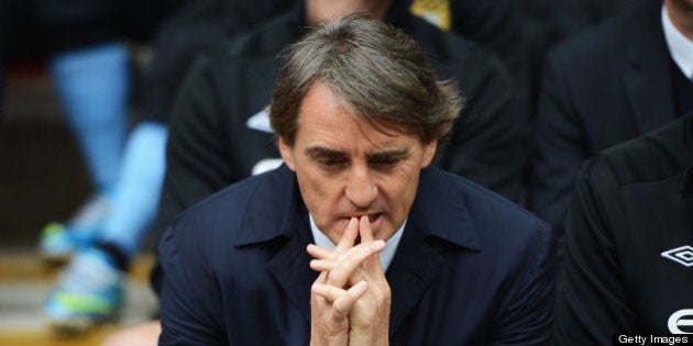 LONDON, ENGLAND - MAY 11: Roberto Mancini, manager of Manchester City looks dejected during the FA Cup...