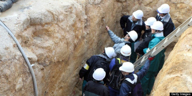 This picture, taken on December 1, 2012 shows geologists checking fault lines near Japan Atomic Power Company's Tsuruga nuclear power plant in Fukui prefecture, western Japan. Experts of the Nuclear Regulation Authority (NRA) investigating the tectonic situation underneath Tsuruga plant said it showed signs of recent geologically movement on December 10. The Tsuruga nuclear plant may be sited over an active seismic fault, indicating that it will probably be scrapped. AFP PHOTO / JIJI PRESS JAPAN OUT (Photo credit should read STR/AFP/Getty Images)