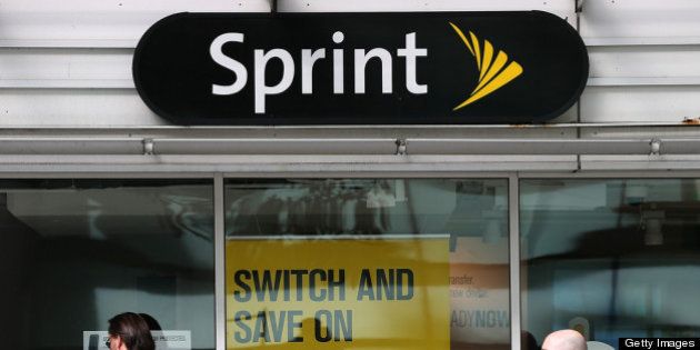 SAN FRANCISCO, CA - APRIL 15: Pedestrians walk by a Sprint store on April 15, 2013 in San Francisco, California. Dish Network Corp has offered to purchase Sprint Nextel Corp for $25.5 billion in cash and stock. (Photo by Justin Sullivan/Getty Images)