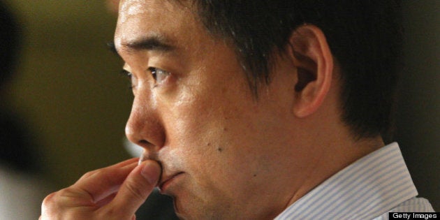 Osaka Mayor and Japan Restoration Party co-leader Toru Hashimoto speaks to repoprters at Osaka city hall...