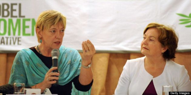 Nobel Peace Laureates Jody Williams (L) from the US addresses a press conference as Mairead Maguire (R) from Northern Ireland looks on in New Delhi on October 29, 2009. Nobel peace laureates called for governments in the region to use the forthcoming elections in Myanmar to push the ruling military junta harder on democratic rights. AFP PHOTO/ Prakash SINGH (Photo credit should read PRAKASH SINGH/AFP/Getty Images)