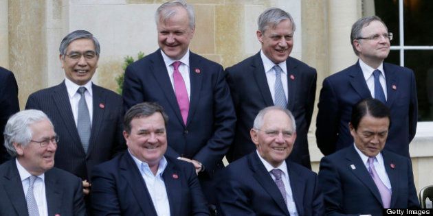 AYLESBURY, ENGLAND - MAY 10: (Front row L-R) Mervyn King, Governor of the Bank of England, Jim Flaherty, Finance Minister of Canada, Wolfgang Schauble Federal Minister of Finance of Germany and Taro Aso, Finance Minister of Japan, pose for the family group photo at the G7 finance ministers and central bank governors meeting on Friday May 10, 2013 in Aylesbury, England. The role of central banks in shoring up the global economic recovery is set to be a key point of discussion among top financial officials from the world's seven leading economies when they gather in the UK this weekend. In a statement Friday ahead of the Group of Seven's two-day meeting at a country house around 50 miles (80 kilometers) northwest of London, British finance minister George Osborne said the main task officials face over the coming two days is looking at how to 'nurture' the recovery. (Photo by Alastair Grant - WPA Pool / Getty Images)