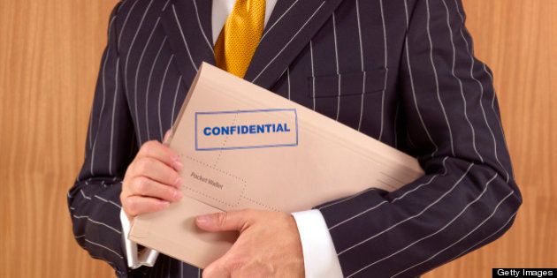 Politician with confidential file folder