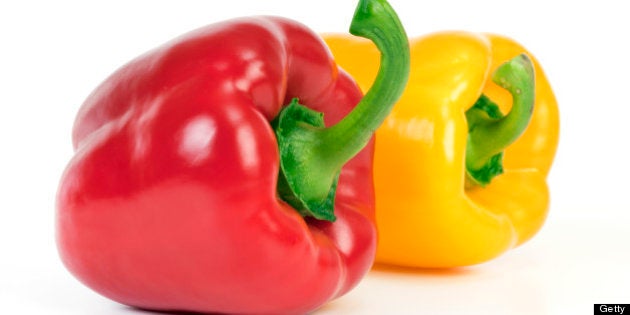 Yellow and red bell pepper isolated on white background.