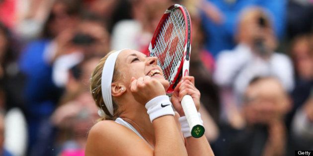 LONDON, ENGLAND - JULY 02: Sabine Lisicki of Germany celebrates match point during the Ladies' Singles quarter-final match against Kaia Kanepi of Estonia on day eight of the Wimbledon Lawn Tennis Championships at the All England Lawn Tennis and Croquet Club at Wimbledon on July 2, 2013 in London, England. (Photo by Julian Finney/Getty Images)