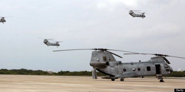OKINAWA, JAPAN - MARCH 12: (EDITORS NOTE: Image has been reviewed by U.S. Military prior to transmission.) In this handout image provided by U.S. Navy, CH-46E Sea Knight helicopters assigned to Marine Medium Helicopter Squadron (HMM) 265, depart Marine Corps Air Station Futenma for Naval Air Facility Atsugi on mainland Japan in response to an earthquake that hit mainland Japan March 12, 2011 in Okinawa, Japan. An earthquake measuring 8.9 on the Richter scale has hit the northeast coast of Japan causing tsunami alerts throughout countries bordering the Pacific Ocean. (Photo by Lance Cpl. Dengrier Baez/ U.S. Navy via Getty Images)