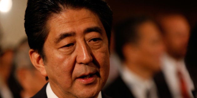 BUENOS AIRES, ARGENTINA - SEPTEMBER 07: Prime Minister Shinzo Abe speaks in the mixed zone during the Tokyo 2020 bid presentation during the 125th IOC Session - 2020 Olympics Host City Announcement at Hilton Hotel on September 7, 2013 in Buenos Aires, Argentina. (Photo by Scott Halleran/Getty Images)