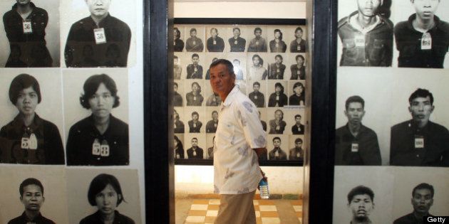 A man visits Tuol Sleng genocide museum in Phnom Penh, 26 June 2006. Twenty-seven years after the fall of the genocidal Khmer Rouge, judges will be sworn on 03 June to a joint UN-Cambodian tribunal in a symbolic start to the prosecution of the regime's surviving leaders. The swearing-in is a 'significant and important event... to show that the legal process of the trial to try former Khmer Rouge leaders is taking place,' the tribunal's spokesman Reach Sambath said. AFP PHOTO/ TANG CHHIN SOTHY (Photo credit should read TANG CHHIN SOTHY/AFP/Getty Images)