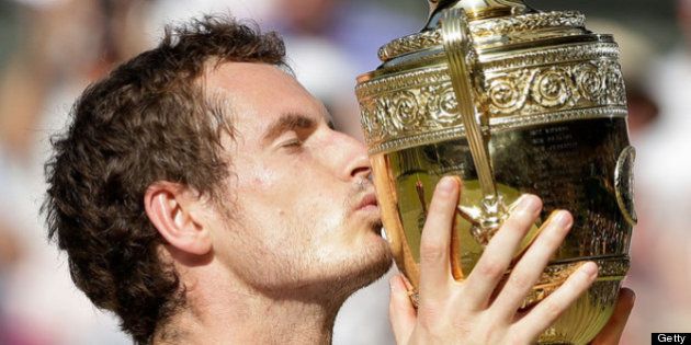 LONDON, ENGLAND - JULY 07: Andy Murray of Great Britain kisses the Gentlemen's Singles Trophy following his victory in the Gentlemen's Singles Final match against Novak Djokovic of Serbia on day thirteen of the Wimbledon Lawn Tennis Championships at the All England Lawn Tennis and Croquet Club on July 7, 2013 in London, England. (Photo by Anja Niedringhaus - Pool/Getty Images)