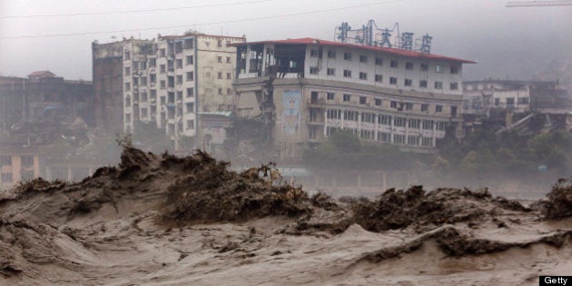 This picture taken on July 9, 2013 shows heavy flood waters sweeping through Beichuan in southwest China's Sichuan province. Rainstorms sweeping across parts of China have affected millions, causing landslides and disabling transportation in provinces such as Sichuan and Yunnan, state media reported. CHINA OUT AFP PHOTO (Photo credit should read AFP/AFP/Getty Images)