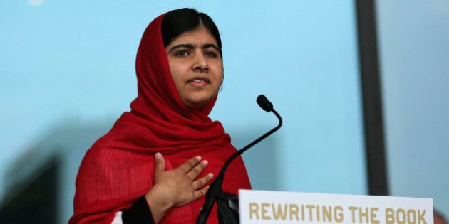 BIRMINGHAM, ENGLAND - SEPTEMBER 03: Malala Yousafzai opens the new Library of Birmingham at Centenary Square on September 3, 2013 in Birmingham, England. The new futuristic building was officially opened by 16-year-old Malala Yousafzai who was attacked by Taliban gunmen on her school bus near her former home in Pakistan in October 2012. The new building was designed by architect Francine Hoube and has cost 189 million GBP. The modern exterior of interlacing rings reflects the canals and tunnels of Birmingham. The library's ten floors will house the city's internationally important collections of archives, photography and rare books as well as it's lending library. (Photo by Christopher Furlong/Getty Images)