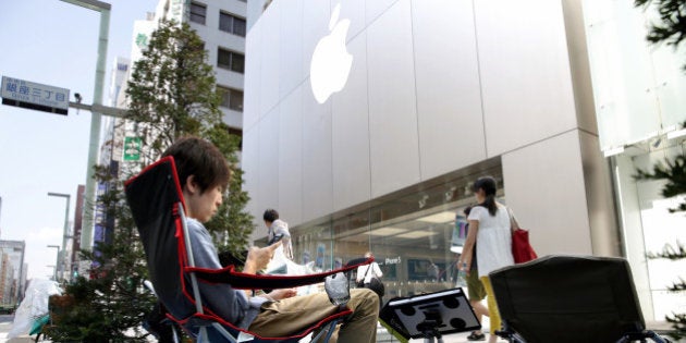 TOKYO, JAPAN - SEPTEMBER 12: (CHINA OUT, SOUTH KOREA OUT) People make a queue for buying the new iPhone...