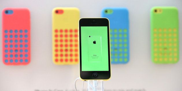 PALO ALTO, CA - SEPTEMBER 20: The new Apple iPhone 5C is displayed at an Apple Store on September 20, 2013 in Palo Alto, California. Apple launched two new models of iPhone: the iPhone 5S, which is preceded by the iPhone 5, and a cheaper, paired down version, the iPhone 5C. The phones come with a new operating system. (Photo by Justin Sullivan/Getty Images)