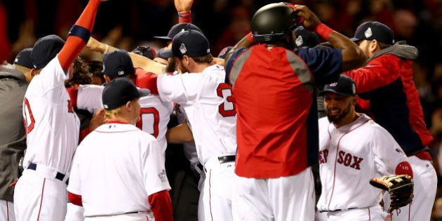 BOSTON, MA - OCTOBER 30: The Boston Red Sox celebrate after defeating the St. Louis Cardinals in Game Six of the 2013 World Series at Fenway Park on October 30, 2013 in Boston, Massachusetts.Boston Red Sox defeated the St. Louis Cardinals 6-1. (Photo by Elsa/Getty Images)