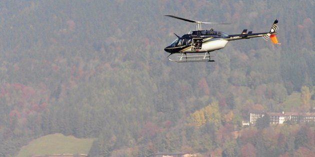 TEGERNSEE, GERMANY - OCTOBER 11: A helicopter with a film camera crew circles above lake Tegernsee after a canoe carrying three people capsized during the shooting of a made for TV movie on 11 October 2007 in Tegernsee, Germany. Two people were rescued, one remains missing. Cast members Christiane Hoerbiger and Elmar Wepper were not in the canoe and remained unharmed, according to police reports. (Photo by Andreas Leder/Getty Images)