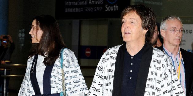 IZUMISANO, JAPAN - NOVEMBER 09: Sir Paul McCartney and Nancy Shevell together arrive at Kansai International Airport on November 9, 2013 in Izumisano, Japan. (Photo by Jun Sato/WireImage)