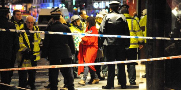 LONDON, UNITED KINGDOM - DECEMBER 19: Members of the emergency services work at the scene after the roof collapsed at The Apollo Theatre on December 19, 2013 in London, England. A number of people have been seriously injured after part of the roof of the famous West End theatre collapsed during a packed performance of 'The Curious Incident of the Dog in the Night-Time'. (Photo by Alan Chapman/Getty Images)