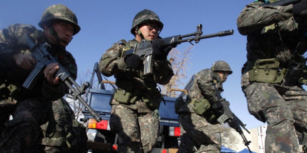 SEOUL, SOUTH KOREA - NOVEMBER 18: South Korean soldiers participate in an anti-chemical and anti-biological terror drill on November 18, 2013 in Seoul, South Korea. The drill comes amid international concerns about terrorism, natural disasters and concerns over North Korea. (Photo by Chung Sung-Jun/Getty Images)