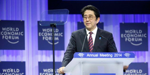 Shinzo Abe, Japan's prime minister, speaks during a session on the opening day of the World Economic Forum (WEF) in Davos, Switzerland, on Wednesday, Jan. 22, 2014. World leaders, influential executives, bankers and policy makers attend the 44th annual meeting of the World Economic Forum in Davos, the five day event runs from Jan. 22-25. Photographer: Jason Alden/Bloomberg via Getty Images