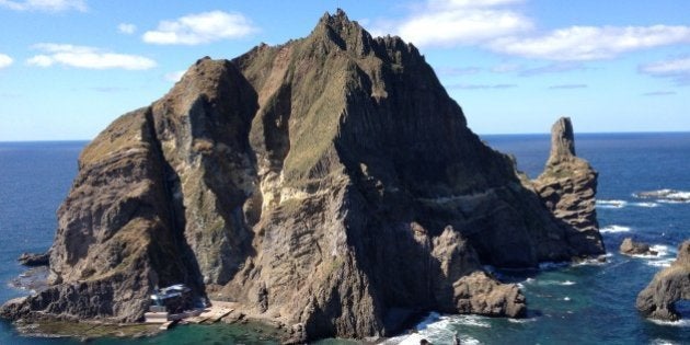 DOKDO/TAKESHIMA ISLANDS, SOUTH KOREA - OCTOBER 4: A fisherman and his wife live at the base of the taller of Dokdo's main two islands, in South Korea on October 4, 2012. (Photo by Chico Harlan/The Washington Post via Getty Images)