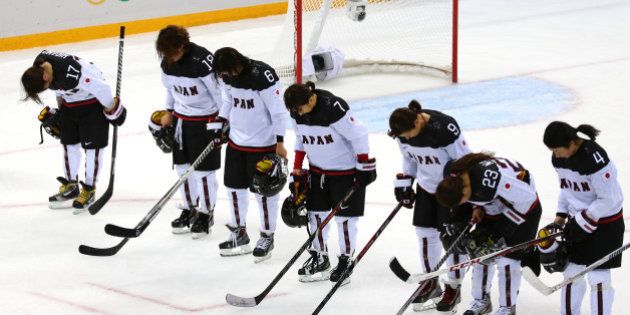 SOCHI, RUSSIA - FEBRUARY 11: Team Japan looks on after being defeated 2 to 1 by Team Russia after their Women's Ice Hockey Preliminary Round Group B game on day four of the Sochi 2014 Winter Olympics at Shayba Arena on February 11, 2014 in Sochi, Russia. (Photo by Martin Rose/Getty Images)