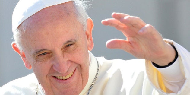 Pope Francis waves to the crowd as he arrives for his general audience in St Peter's square at the Vatican on September 18, 2013 . AFP PHOTO / TIZIANA FABI (Photo credit should read TIZIANA FABI/AFP/Getty Images)