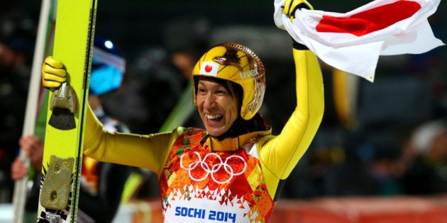 SOCHI, RUSSIA - FEBRUARY 15: Silver medalist Noriaki Kasai of Japan celebrates with the Japanese national flag after the Men's Large Hill Individual Final Round on day 8 of the Sochi 2014 Winter Olympics at the RusSki Gorki Ski Jumping Center on February 15, 2014 in Sochi, Russia. (Photo by Alexander Hassenstein/Getty Images)