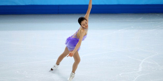 SOCHI, RUSSIA - FEBRUARY 19: Mao Asada of Japan competes in the Figure Skating Ladies' Short Program on day 12 of the Sochi 2014 Winter Olympics at Iceberg Skating Palace on February 19, 2014 in Sochi, Russia. (Photo by Ryan Pierse/Getty Images)