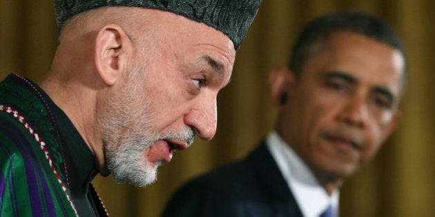 WASHINGTON, DC - JANUARY 11: U.S. President Barack Obama (R) and Afghan President Hamid Karzai speak to the media during a joint news conference in the East Room of the White House January 11, 2013 in Washington, DC. Karzai is in Washington for face-to-face meetings with Obama and senior members of his administration about the future of American commitment to Afghanistan and when troops may leave the country after more than 10 years of war. (Photo by Mark Wilson/Getty Images)