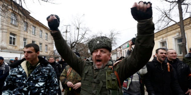 SIMFEROPOL, UKRAINE - MARCH 2: Citizens stop a car near the house of Sergiy Kunitsyn in Simferepol, Ukraine on March 2, 2014. Awaiting of Russian soldiers keeps going on around the Ukranian Navy building in Crimea. (Photo by Bulent Doruk/Anadolu Agency/Getty Images)