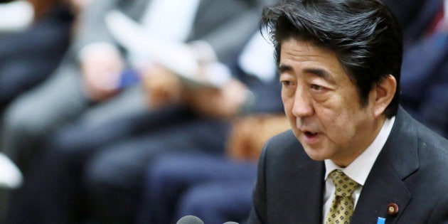 Shinzo Abe, Japan's prime minister, speaks during a budget committee session in the lower house of the Parliament in Tokyo, Japan, on Friday, Feb. 28, 2014. Abe's ruling Liberal Democratic Party is planning a governance code for Japanese companies to boost their competitiveness and enhance investor protection, an official said. Photographer: Haruyoshi Yamaguchi/Bloomberg via Getty Images