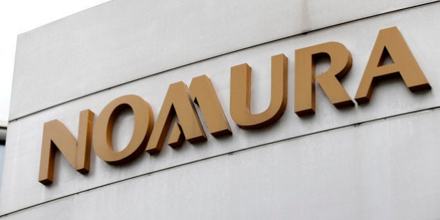 Signage for Nomura Securities Co. is displayed outside one of its branches in Tokyo, Japan, on Sunday, Oct. 28, 2012. Nomura Holdings Inc. is scheduled to announce first-half earnings today. Photographer: Kiyoshi Ota/Bloomberg via Getty Images