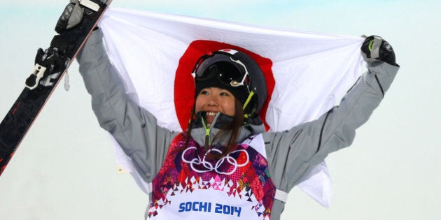 SOCHI, RUSSIA - FEBRUARY 20: Bronze medalist Ayana Onozuka of Japan celebrates during the flower ceremony in the Freestyle Skiing Ladies' Ski Halfpipe Finals on day thirteen of the 2014 Winter Olympics at Rosa Khutor Extreme Park on February 20, 2014 in Sochi, Russia. (Photo by Mike Ehrmann/Getty Images)