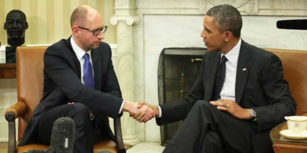 WASHINGTON, DC - MARCH 12: U.S. President Barack Obama (R) shakes hands with Prime Minister of Ukraine Arseniy Yatsenyuk (L) during a bilateral meeting in the Oval Office of the White House March 12, 2014 in Washington, DC. Prime Minister Yatsenyuk was in Washington to discuss the current situation of the Russian military intervention in the Crimea area. (Photo by Alex Wong/Getty Images)
