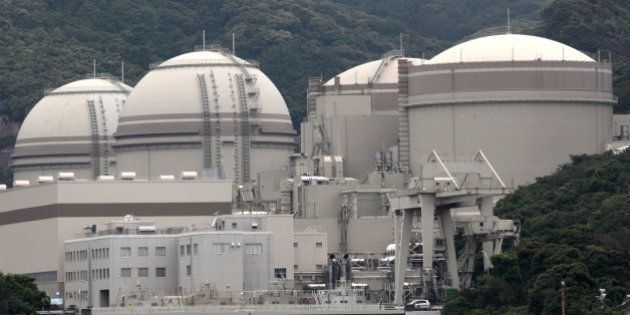 The No. 4, from left, No. 3, No. 2 and No. 1 reactor buildings stand at Kansai Electric Power Co.'s Ohi nuclear power station in Ohi Town, Fukui Prefecture, Japan, on Friday, June 1, 2012. Japan's government moved a step closer to resuming nuclear power generation after last year's Fukushima disaster left the country without atomic energy for the first time in more than four decades. Photographer: Tomohiro Ohsumi/Bloomberg via Getty Images