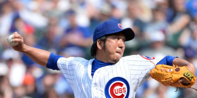 CHICAGO, IL- MAY 19: Relief pitcher Kyuji Fujikawa #11 of the Chicago Cubs delivers during the eighth inning against the New York Mets on May 19, 2013 at Wrigley Field in Chicago, Illinois. (Photo by Brian Kersey/Getty Images)