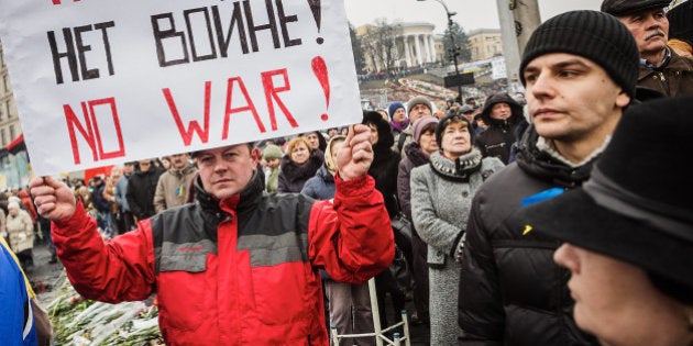 KIEV, UKRAINE - MARCH 2: People attend a rally against Russia on Kiev's Independence square on March 2, 2014 in Kiev, Ukraine. The new government of Ukraine has appealed to the United Nations Security Council for help against growing Russian intervention in Crimea, where thousands of Russian troops reportedly arrived in recent days at Russian military bases and also occupy key government and other installations. World leaders are scrambling to persuade Russian President Vladimir Putin to refrain from further escalation in Ukraine. Ukraine has put its armed forces on combat alert. (Photo by Vladislav Sodel/Kommersant Photo via Getty Images)