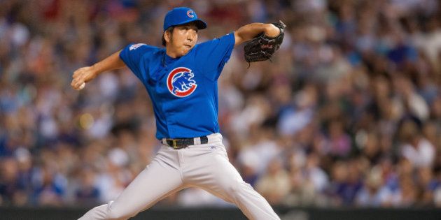 DENVER, CO - AUGUST 06: Kyuji Fujikawa #11 of the Chicago Cubs pitches in the sixth inning of a game against the Colorado Rockies at Coors Field on August 6, 2014 in Denver, Colorado. (Photo by Dustin Bradford/Getty Images)