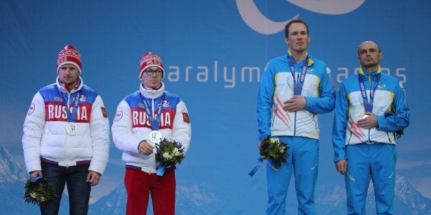 SOCHI, RUSSIA - MARCH 09: Vitaliy Lukyanenko of Ukraine with guide, Borys Babar win gold in the Men's 7.5km Visually Impaired Biathlon during the 2014 Sochi Paralympic Games on March 9, 2014 in Sochi, Russia. (Photo by Ian Walton/Getty Images)