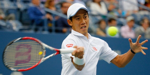 NEW YORK, NY - SEPTEMBER 08: Kei Nishikori of Japan returns a shot against Marin Cilic of Croatia during...
