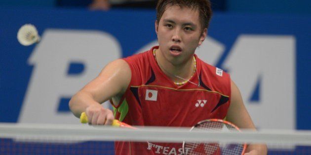 Kenichi Tago of Japan hits a return against Lee Chong Wei of Malaysia at the badminton 2014 Indonesia Open men singles semi-final match in Jakarta on June 21, 2014. Kenichi Tago won 21-16, 15-21, 21-16. AFP PHOTO / ADEK BERRY (Photo credit should read ADEK BERRY/AFP/Getty Images)