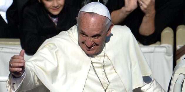 Pope Francis greets the crowd from the popemobile after a papal mass for the beatification of Paul VI, who died in 1978, and the end of Vatican's synod on the family at St Peter's square on October 19, 2014 at the Vatican. AFP PHOTO / FILIPPO MONTEFORTE (Photo credit should read FILIPPO MONTEFORTE/AFP/Getty Images)