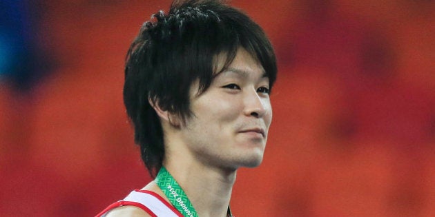 NANNING, CHINA - OCTOBER 09: Gold medalist Kohei Uchimura of Japan celebrates during the medal ceremony after the Men's All-Around Final in day three of the 45th Artistic Gymnastics World Championships at Guangxi Sports Center Stadium on October 9, 2014 in Nanning, China. (Photo by Lintao Zhang/Getty Images)