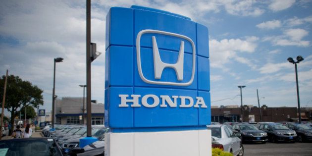 Honda Motor Co. signage is displayed at the Paragon Honda dealership in the Queens borough of New York,...