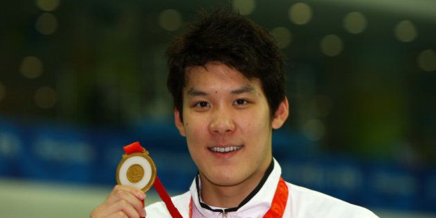 BEIJING - AUGUST 10: Park Taehwan of South Korea poses with the gold medal during the medal ceremony for the Men's 400m Freestyle event held at the National Aquatics Center during day 2 of the Beijing 2008 Olympic Games on August 10, 2008 in Beijing, China. (Photo by Shaun Botterill/Getty Images)
