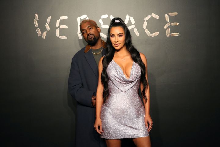 Kanye West and Kim Kardashian pose for a photo before attending the Versace presentation in New York, U.S. Dec. 2, 2018. 