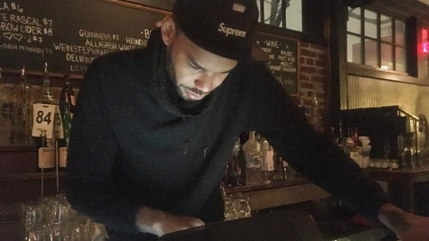 Tim Slayton, 36, rings up a drink at Marvin, a 14th Street bar in Washington, D.C. Millennials and Gen Z make up about 35 per