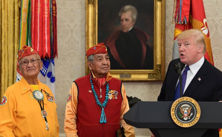 Here's Trump standing with Native American veterans in front of a portrait of Andrew Jackson in the Oval Office. He attacked Elizabeth Warren as "Pocahontas" at this event.