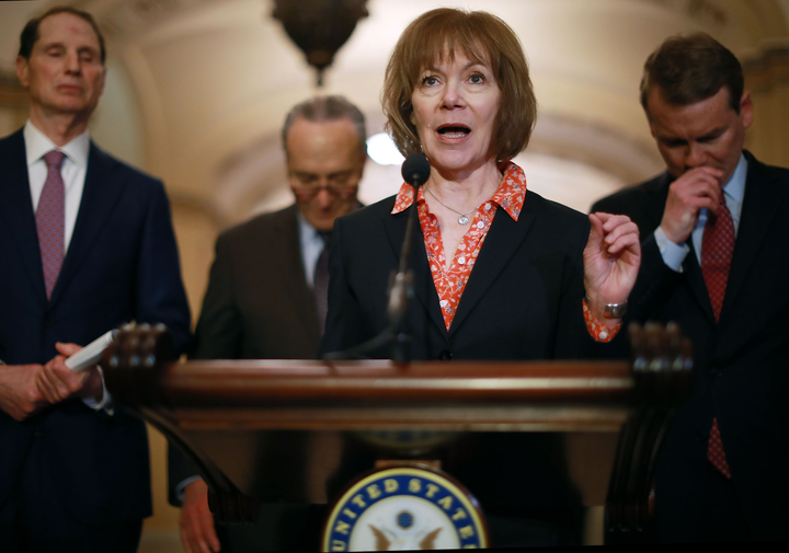 Democrats, led by Sen. Tina Smith (center), are pushing a bill to allow federal agencies to reimburse contractors that pay workers who missed checks during the shutdown.